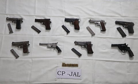 The police recovered nine weapons from their possession, including eight pistols and one revolver, along with 15 live cartridges.