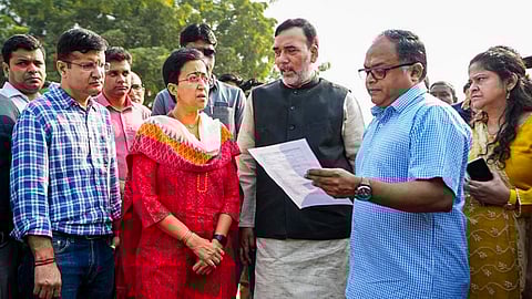 Delhi Chief Minister Atishi and Environment Minister Gopal Rai review the steps being taken to reduce air pollution at Anand Vihar in New Delhi, Oct. 20, 2024.