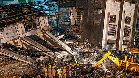 Rescue work underway after an under-construction building collapsed at Hennur, in Bengaluru.