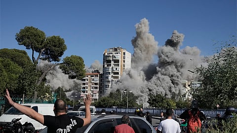 Images capture the exact moments an Israeli bomb strikes a building in Beirut 