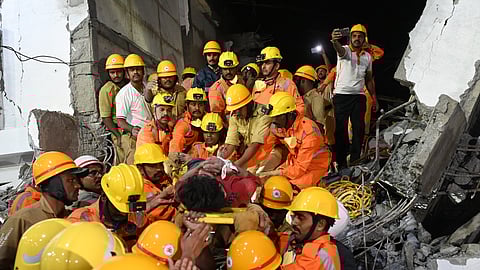 The NDRF, along with police and fire department officials, carry out rescue operations to save the trapped labourers in the collapsed six-storey building in Bengaluru on Tuesday, Oct. 22, 2024. 