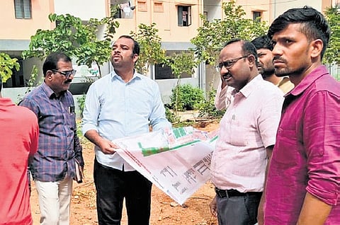Officials conduct a survey for the establishment of a school at Kollur 2BHK houses in Sangareddy on Wednesday