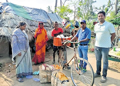 A family from Magarkandha moving to a cyclone shelter on Wednesday 