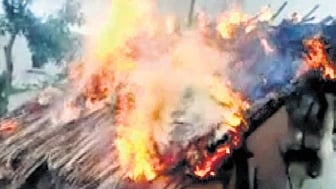 A file photo of huts set on fire at Marukumbi village in Koppal in 2014