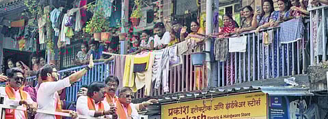 Shiv Sena (UBT) leader Aaditya Thackeray with others waves to supporters during his nomination rally for the upcoming Maharashtra 
Assembly elections, in Mumbai.