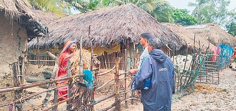 A woman being asked to move to a cyclone shelter in Charigharia village 