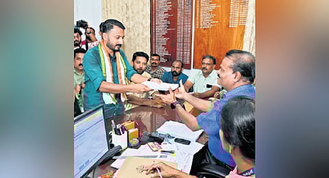UDF candidate Rahul Mamkootathil submitting the nomination papers to Palakkad RDO S Sreejith.