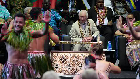 Britain's King Charles watches dancers perform during the opening ceremony for the Commonwealth Heads of Government meeting in Apia, Samoa, Friday, Oct. 25, 2024.