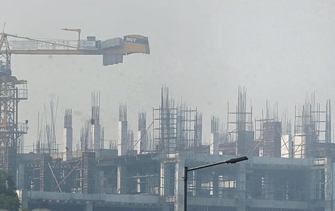 Thick smog and haze envelope a construction site in the city on Friday 