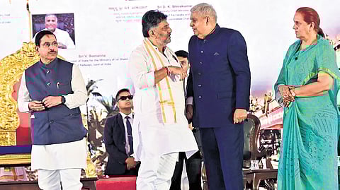 Vice-President Jagdeep Dhankhar and his wife Sudesh were greeted by DyCM DK Shivakumar at ‘Namah Shivaya’  of Sri Sri Bharatiteertha Mahanasannidhanam. Union Minister Pralhad Joshi looks on  