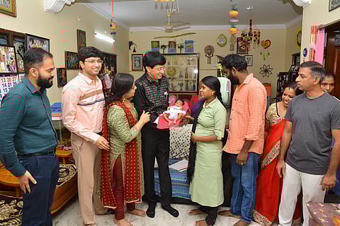 Dr J Radhakrishnan, IAS, and his family members with Sowmya, her newborn and other family members on Saturday