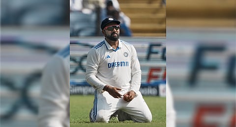 New Zealand players celebrate Rohit Sharma’s wicket in Pune on Saturday 