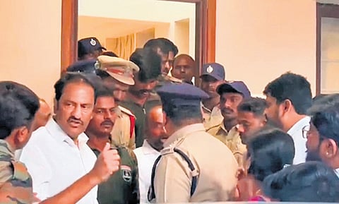 MLA Maganti Gopinath and MLC Shambipur Raju argue with police personnel at the residence of Raj Pakala in Janwada 