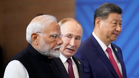 (L to R) Prime Minister Narendra Modi, Russian President Vladimir Putin and Chinese President Xi Jinping attend a family photo ceremony prior to the BRICS Summit plenary session in Kazan, Russia, Wednesday, Oct. 23, 2024. 
