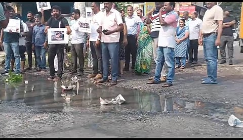 Residents protesting over bad smell and potholed roads in Bengaluru.