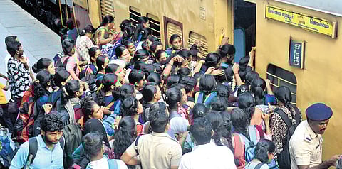 Passengers crowding to board the Chennai-Kollam Express at the Egmore Railway Station in Chennai on Tuesday.