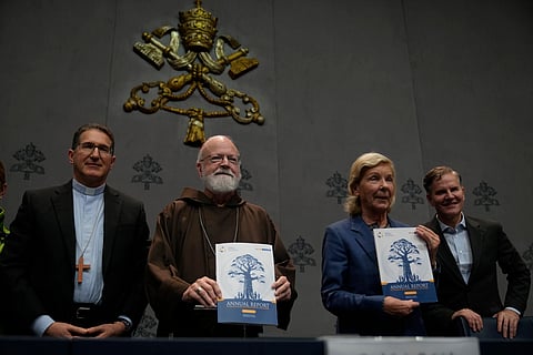 From left, Monsignior Luis Herrera, Cardinal Sean Patrick O' Malley, jurist Maud de Boer-Buquicchio and clergy sex abuse survivor and victim's advocate Juan Carlos Cruz, pose for a photo at the end of a press conference to present the Vatican's first Annual Global Report on Minors Protection at the Vatican press center, Tuesday, Oct. 29, 2024.
