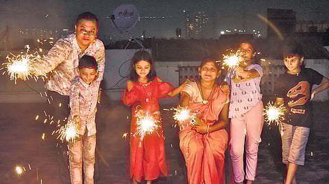 A family celebrating Deepavali with fireworks at Parrys