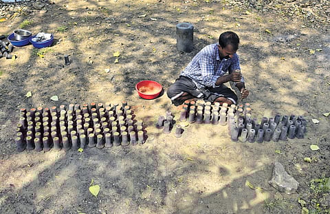 Shibu, who hails from Piravom, preparing kadina for a celebratory fireworks display at Subrahmanya temple at Vyttila 
