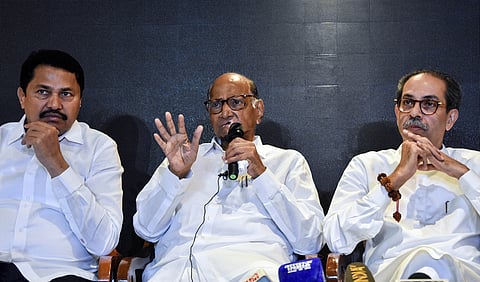 Union Minister and senior BJP leader Amit Shah, Maharashtra BJP leader Devendra Fadnavis, and Shiv Sena leader Eknath Shinde exchange greetings during a meeting at Nadda's residence in New Delhi on Thursday, Nov. 28, 2024.