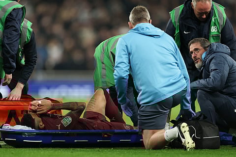 Manchester City's Savinho receives medical treatment after sustaining an injury during the English League Cup fourth round soccer match between Tottenham and Manchester City on Wednesday, Oct 30, 2024. 