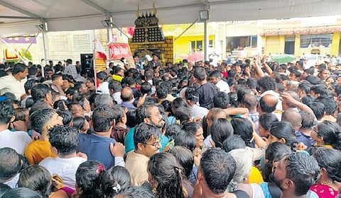 A large number of devotees jostle to get into the Hasanamba temple in Hassan on Thursday evening