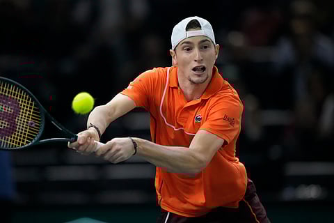 France's Ugo Humbert backhands to Spain's Carlos Alcaraz during their third round match of the Paris Masters tennis tournament at the Accor Arena, Thursday, Oct. 31, 2024 in Paris.