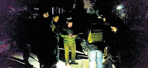 Security personnel stand guard near the house where militants were allegedly hiding during an encounter at Khanyar area of Srinagar, on Saturday, Nov. 2, 2024. An encounter broke out between security forces and terrorists on Saturday in the locality of Jammu and Kashmir's summer capital, officials said.