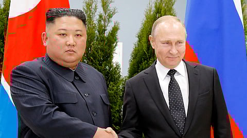 Russian President Vladimir Putin, right, and North Korea's leader Kim Jong Un shake hands during their meeting in Vladivostok, Russia.