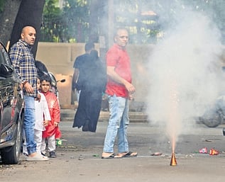A man lights a flowerpot in Jayamahal on Friday 