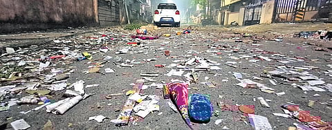 Cracker waste strewn across city streets in the morning after Deepavali 