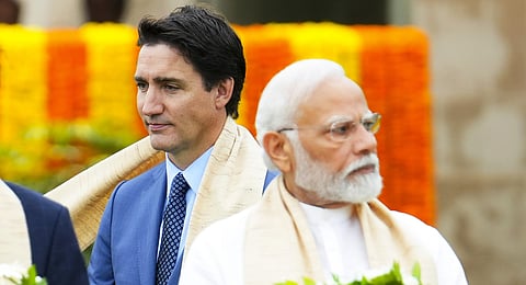 Prime Minister Narendra Modi with his Canadian counterpart Justin Trudeau as they take part in a wreath-laying ceremony at Raj Ghat during the G20 Summit in New Delhi in September 2023.