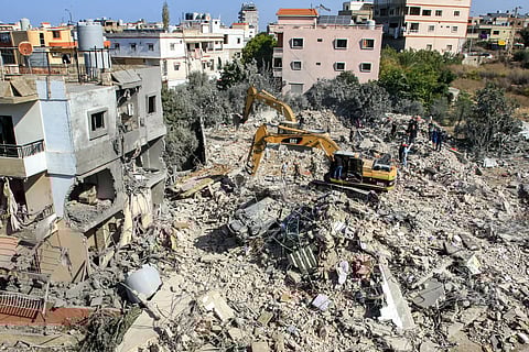 An excavator clears rubble and debris at the site of an overnight Israeli air strike on town of Sarafand, between Sidon and Tyre in southern Lebanon, on October 30, 2024.