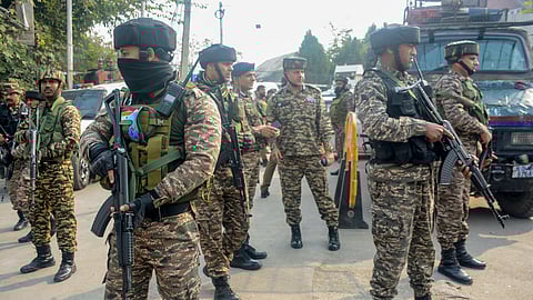 Security personnel stand guard near the house where militants were allegedly hiding during an encounter at Khanyar area of Srinagar, on Saturday, Nov. 2, 2024. An encounter broke out between security forces and terrorists on Saturday in the locality of Jammu and Kashmir's summer capital, officials said.