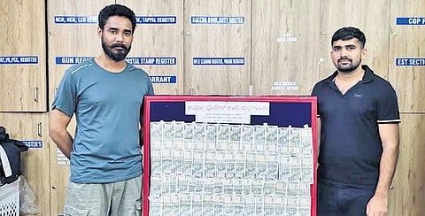 Raj Kumar Meena, 23, and Subhash Gurjar, 27, arrested by the Mangaluru police for duping Amazon, with cash seized from them 