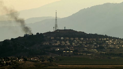 A photo taken from the southern Lebanese area of Marjayoun, shows smoke rising from the Israeli village of Metullah.