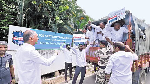 Former minister T Harish Rao stages a protest against the arrest of former sarpanches at the Trimulgherry police station in Hyderabad on Monday
