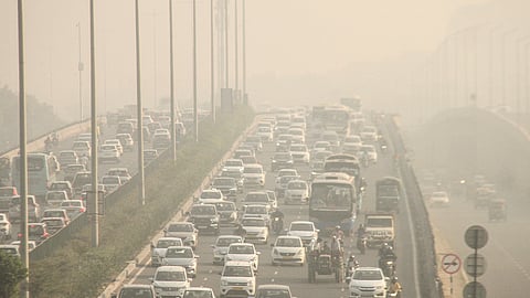 Vehicles ply on Gurugram-Delhi Expressway amid low visibility due to smog, in Gurugram, Sunday, Nov. 3, 2024
