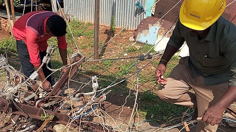Tangedco staff put an effort into reconstructing the electricity lines that were broken at Shankar Nagar near Mettupalayam on Saturday night due to heavy wind and rain. 