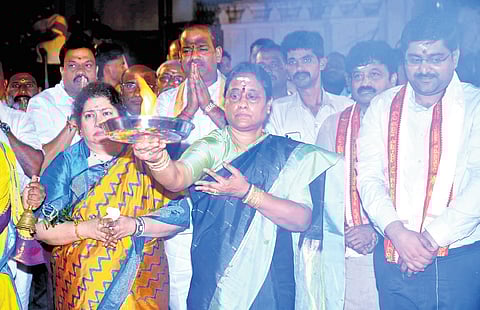 Endowments Minister Konda Surekha offers ‘haarati’ at the Keesaragutta temple during the Kartheeka Deepotsavam programme on Monday