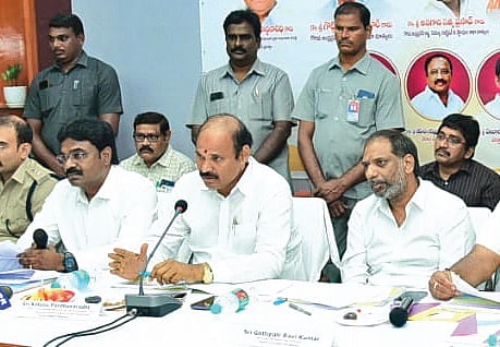 Housing Minister Kolusu Parthasarathy addressing the DRC meeting in Bapatla on Tuesday