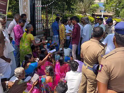 Tribal residents from Kotturmalai arguing with the police outside the collectorate. They had come to seek an explanation on the delay in road construction