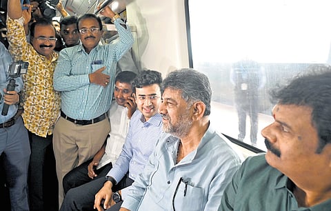 DyCM DK Shivakumar and  MP Tejasvi Surya take a Metro ride on the newly extended Green Line from Nagasandra to Madavara on Wednesday. 