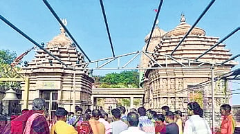 Servitors and locals at the temple entrance on Wednesday 