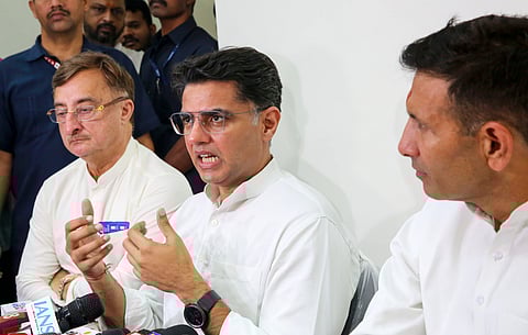 Congress leader Sachin Pilot with Rajya Sabha MP Vivek Tankha and Madhya Pradesh party President Jitendra Patwari addresses a press conference, in Bhopal.