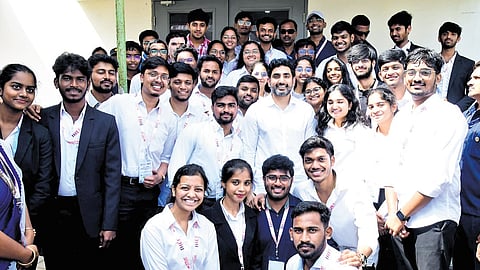 HRD Minister Nara Lokesh posing for a photograph with students at VIT-AP’s International Higher Education Fair in Amaravati on Thursday