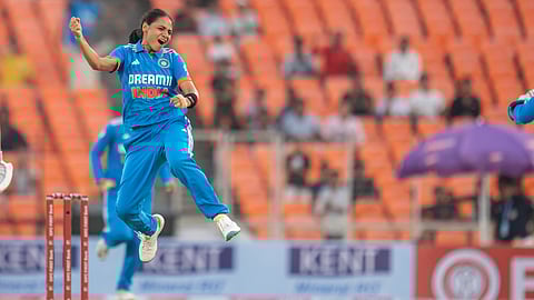 Saima Thakor celebrates after taking a wicket