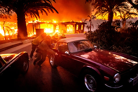 Wildfires spread across Southern California, destroying homes and prompting evacuations