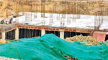 Ongoing construction at pond land in Budhela village 