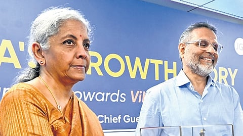Dr Chenraj Roychand, principal of Jain University, presents a memento to Finance Minister Nirmala Sitharaman on Saturday 